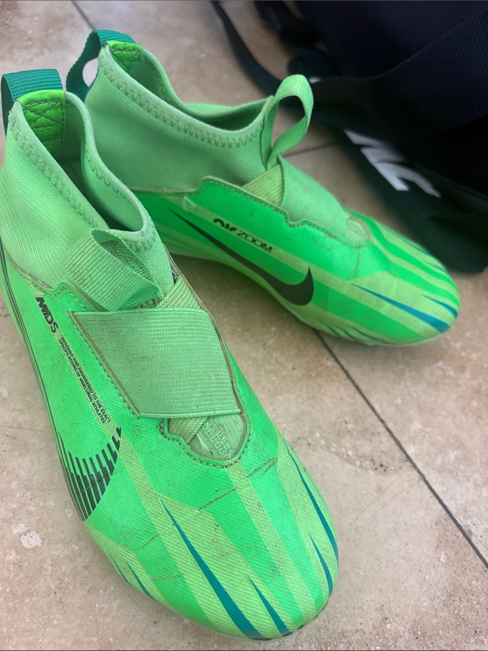 Nike Kids' Bright Green Laceless Soccer Cleats with Black Swoosh